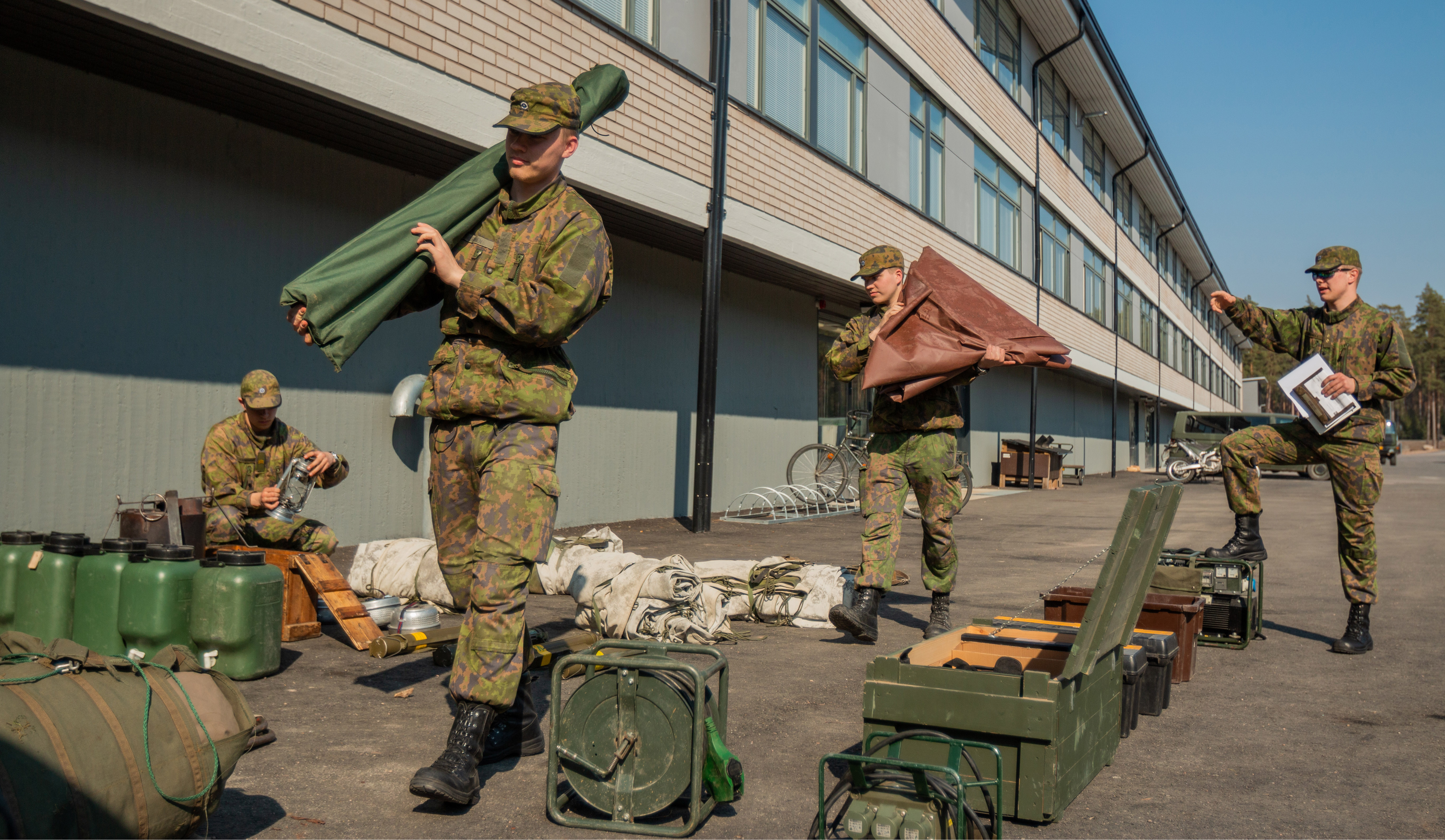 Soldiers carrying equipment